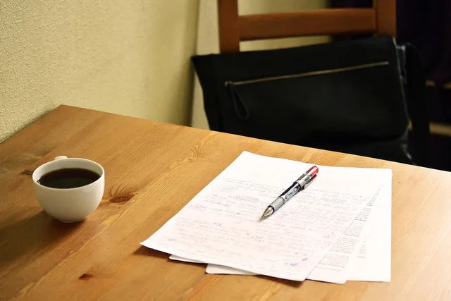 correcting, papers, english teacher, teacher, english, coffee, work, working, correct, mistake, red, pen, red pen, edit, fix, wrong, document, review, error, correction, editor, wood, wooden, table, proofread, check, grammar, test, editing, reviewing, education, school, accuracy, proofreading, revising, revise, proofread, proofread, grammar, proofreading, proofreading, proofreading, proofreading, proofreading. Putting AI to work in multilingual social marketing one boxed task at a time