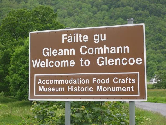 Glencoe road sign in Gaelic and English, Scotland. How Scotland and England language policies differ for multilingual social marketing